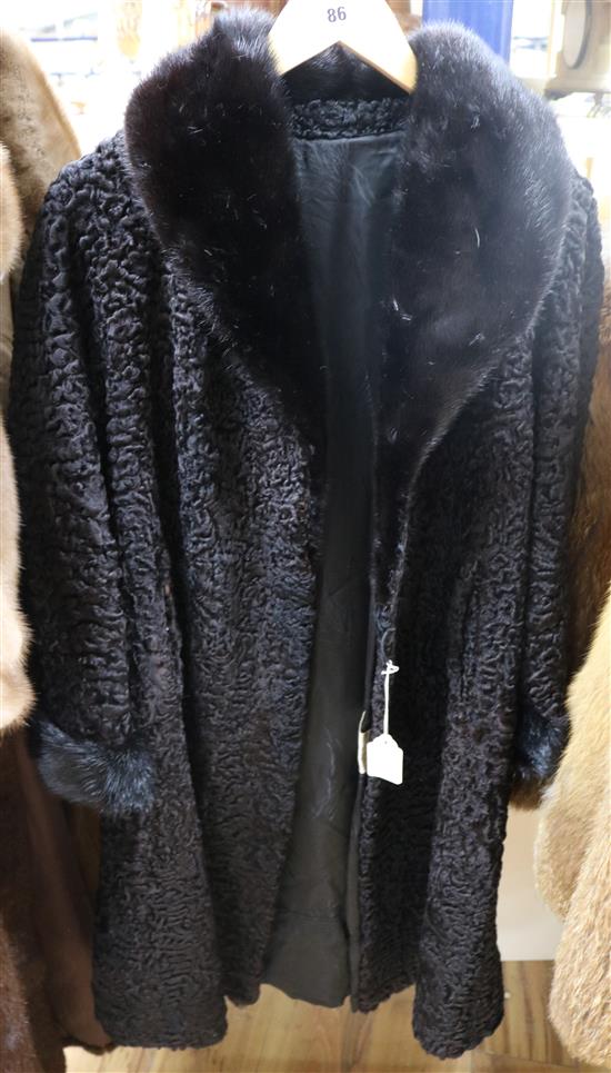 An astrakhan coat with black mink collar